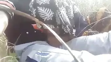 Bangladeshi Hijabi girl giving blowjob outdoors
